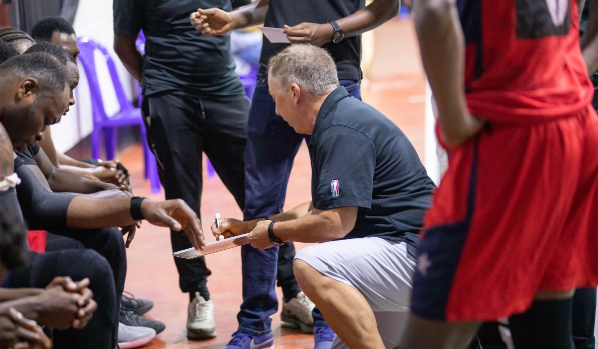Rwanda Energy Group (REG) head coach Dean Murray gives instructions to his players. Dan Gatsinzi
