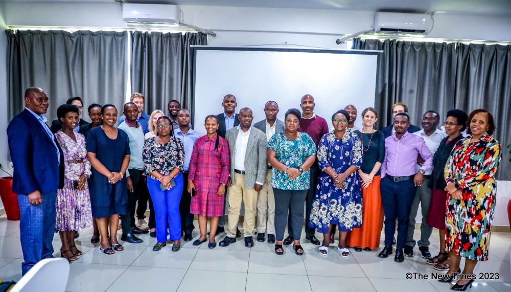 Participants and trainers pose for a group photo after completing a three-day workshop. All Photos by Craish BAHIZI