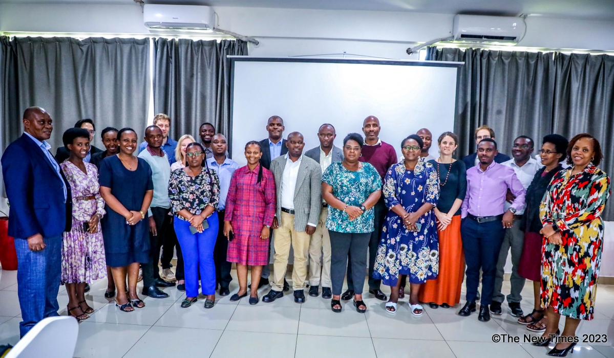 Participants and trainers pose for a group photo after completing a three-day workshop. All Photos by Craish BAHIZI