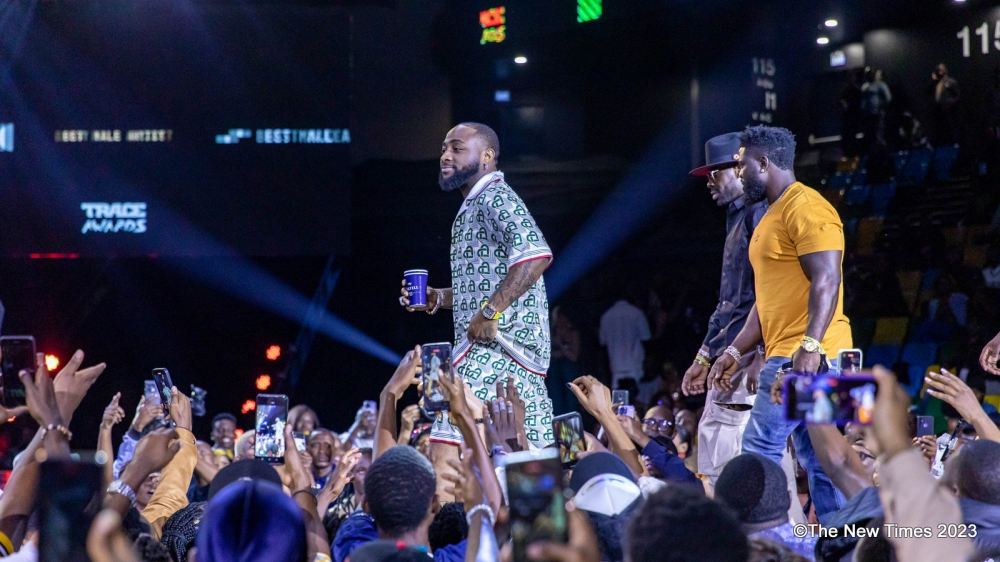 The Nigerian Superstar Davido stole the show with his continual moving in and out, changing outfits, and imposing team that followed him everywhere. All photos by Dan Gatsinzi