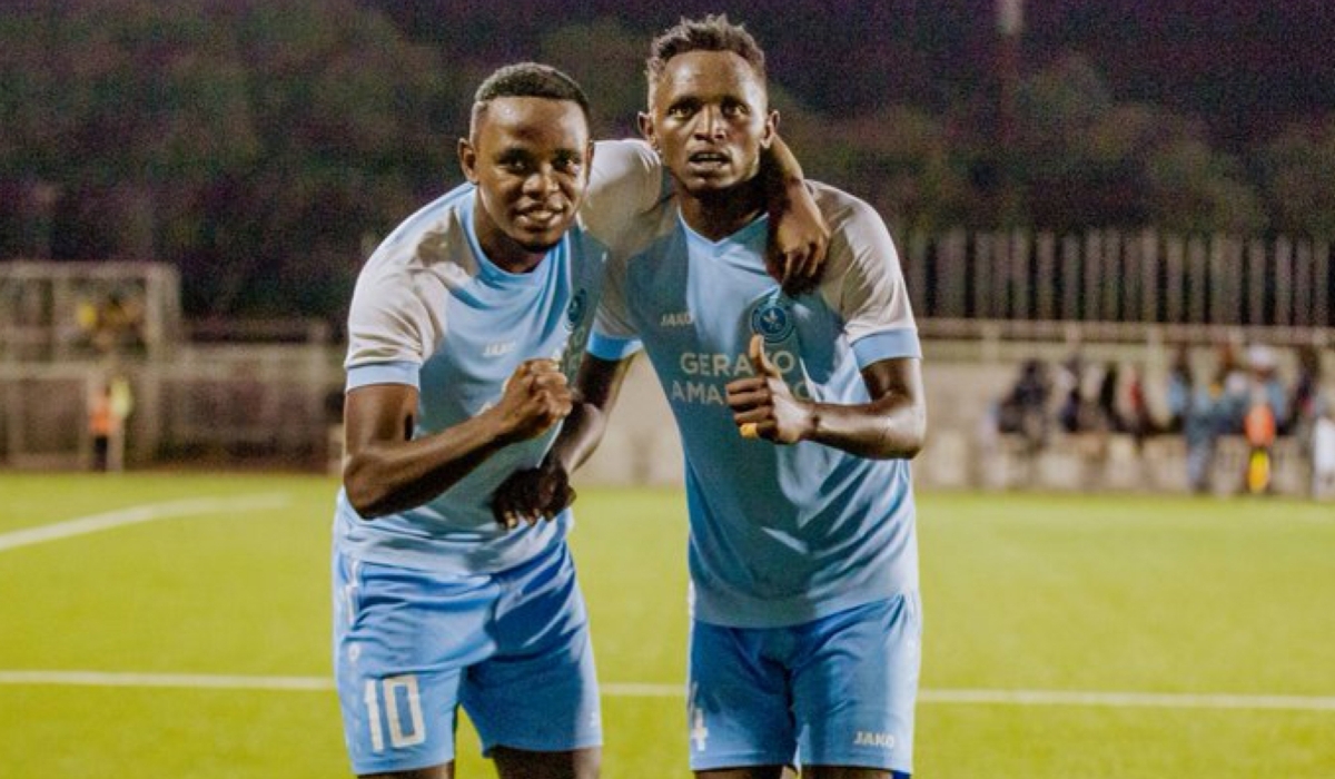 Former SC Kiyovu striker Bienvenue Mugenzi (Right) with Muhadjiri Hakizamana pose for photo as their side Police FC beat Kiyovu 3-1 at Kigali Pele Stadium. Courtesy