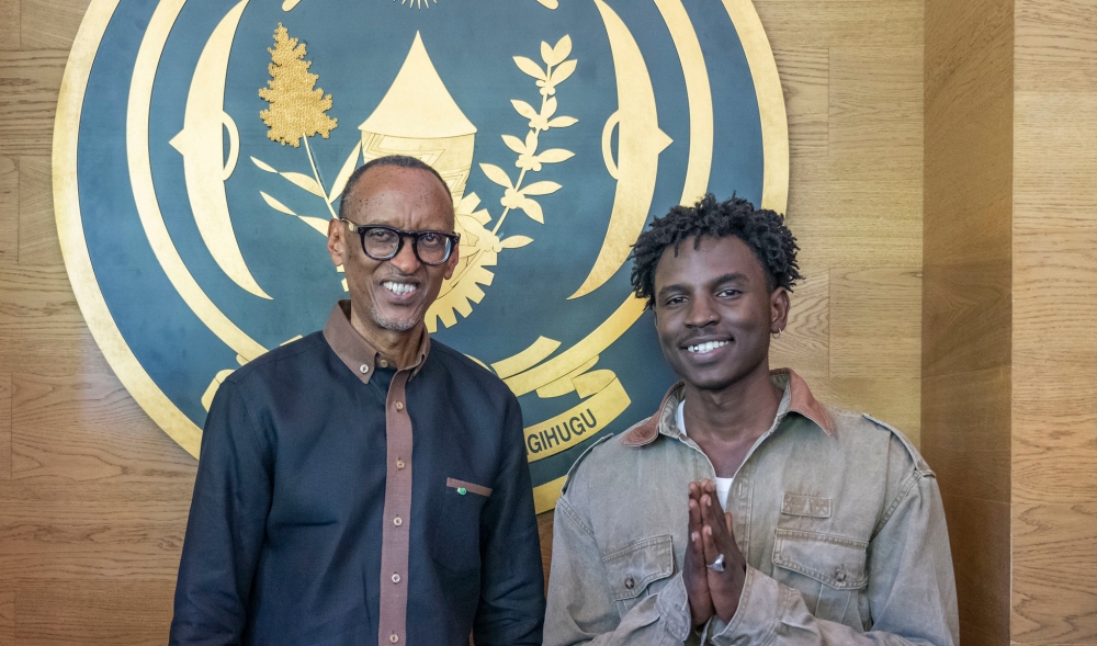 President Kagame poses for a photo  with Popular Rwandan rapper Ish Kevin on Sunday, October 22. PHOTO BY VILLAGE URUGWIRO