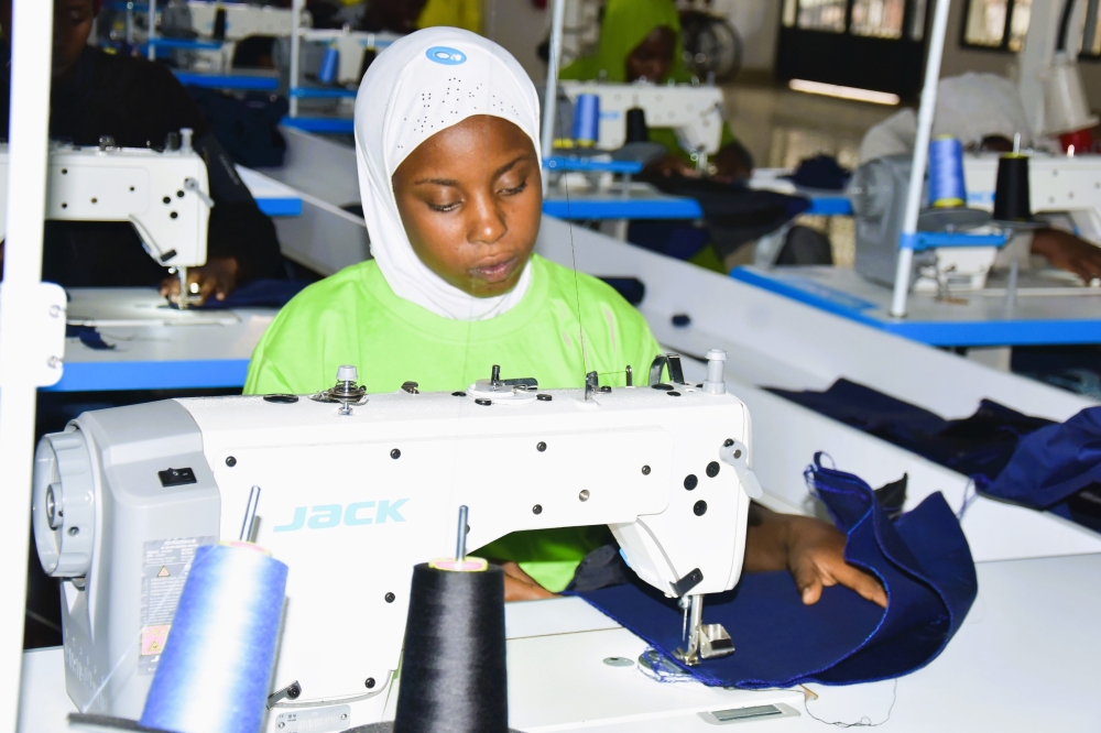 Sumaya Uwiringiyimana, an alumna beneficiary of USAIDTurengere Abana programmes, successfully completed training in tailoring.