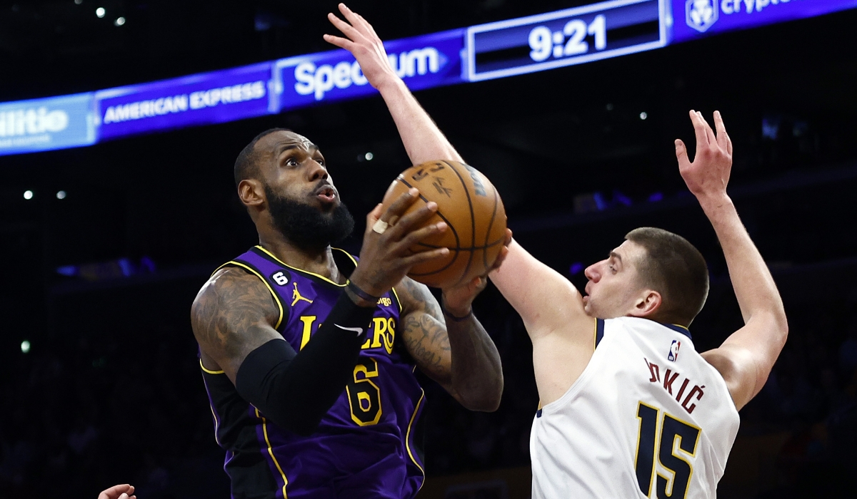 LeBron James #6 of the Los Angeles Lakers takes a shot against Nikola Jokic #15 of the Denver Nuggets in the second half at Crypto.com Arena on December 16, 2022 in Los Angeles, California. (Photo by Ronald Martinez/Getty Images)