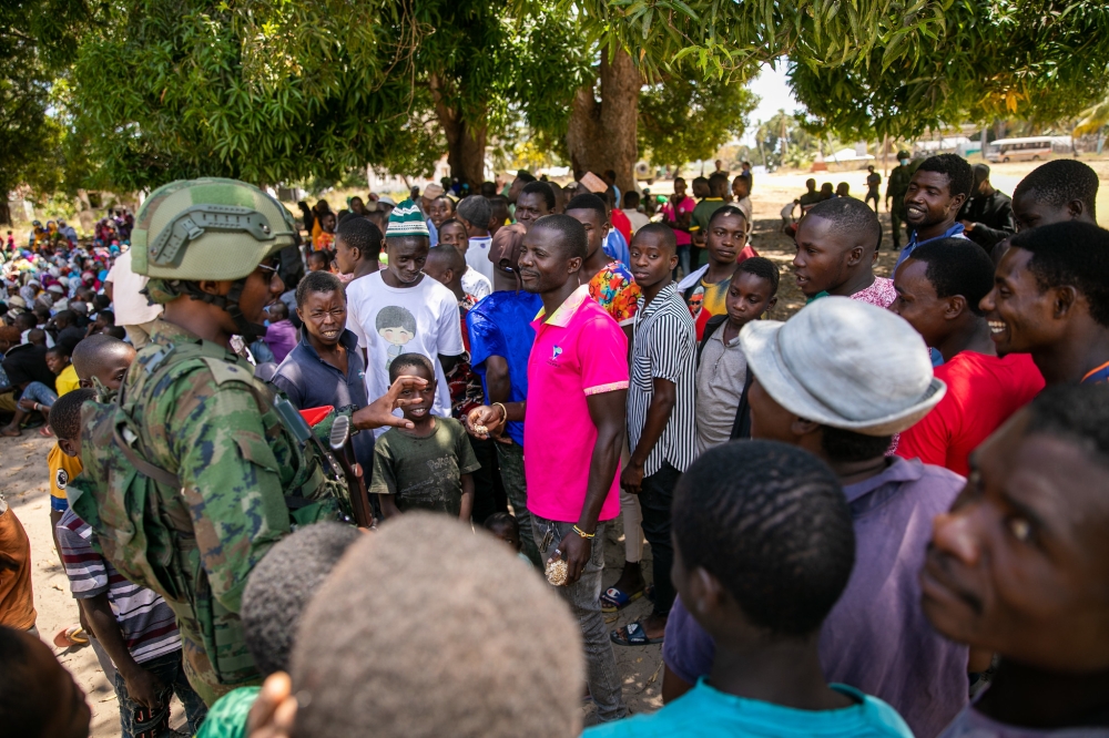 One of Rwandan Forces in Cabo Delgado, interacts with some residents after  pacifying region that was occupied by terrorists. Photo by Olivier Mugwiza