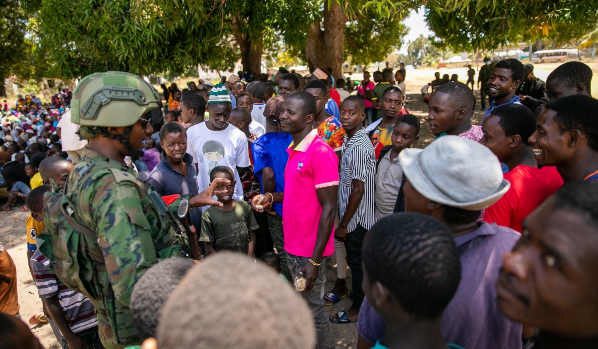 One of Rwandan Forces in Cabo Delgado, interacts with some residents after  pacifying region that was occupied by terrorists. Photo by Olivier Mugwiza