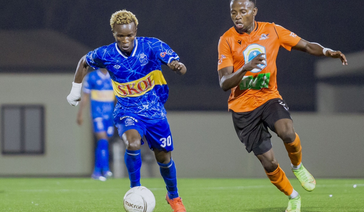 Rayon Sports star forward Joackiam Ojera with the ball against Gasogi&#039;s defender. Ojera  will feature in the squad to play a derby with bitter rivals APR at Kigali Pele Stadium. Courtesy