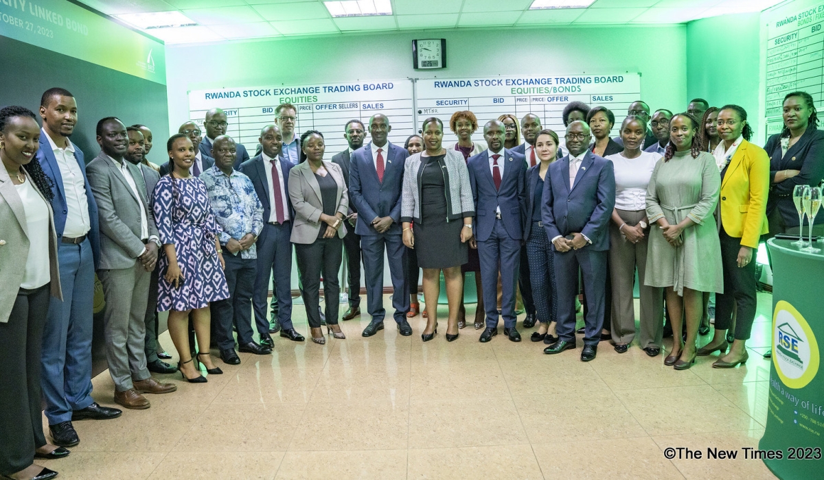 Officials of the Development Bank of Rwanda (BRD), Ministry of Finance and Economic Planning, Rwanda Stock Exchange pose for a group photo after BRD listed its Rwf30 billion Sustainability-Linked Bond on stock market. PHOTOS BY EMMANUEL DUSHIMIMANA