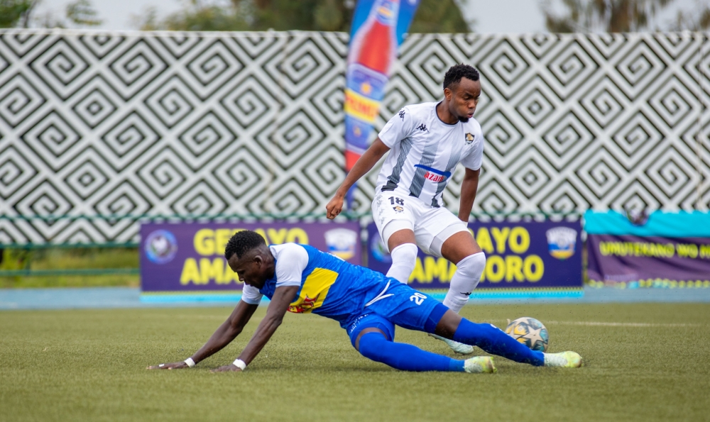 APR FC defender Prince Buregeya wins the ball against Rayon Sports&#039; player during a past derby at Huye Stadium on February 12, 2023. PHOTO BY OLIVIER MUGWIZA