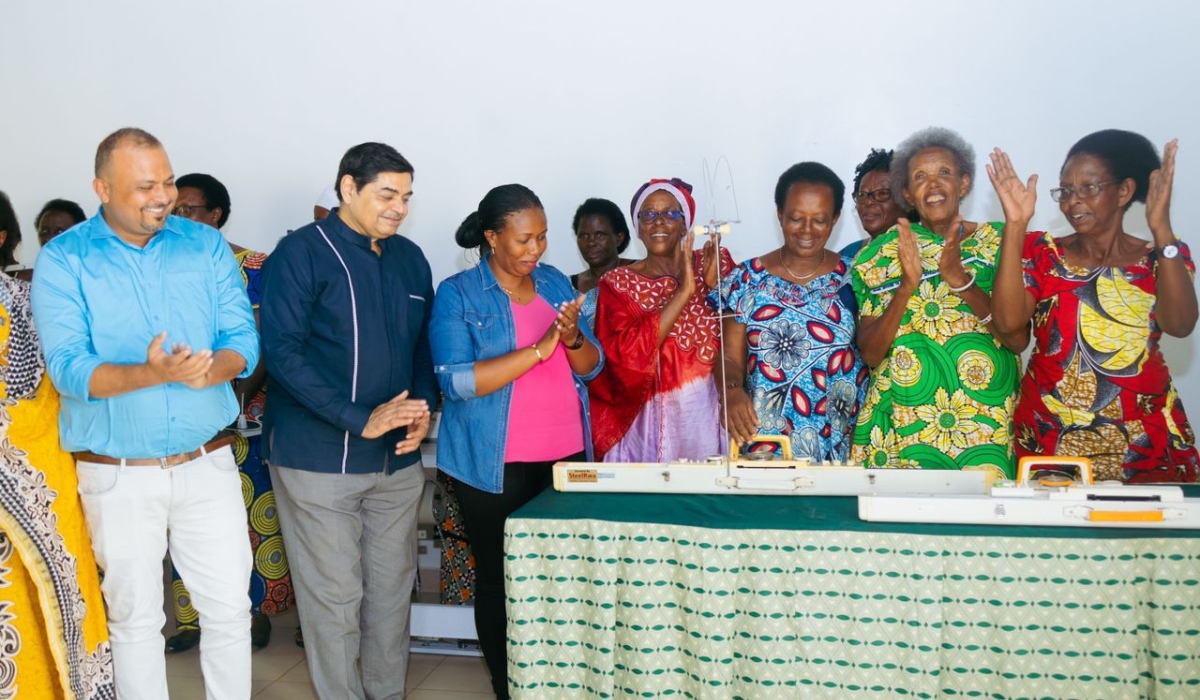  Members of the Association of Widows of the Genocide, AVEGA-Agahozo who are beneficiaries of the donation, thank Steel Rwa officials during the handover ceremony of six electric sewing machines on Friday October 27. Courtesy