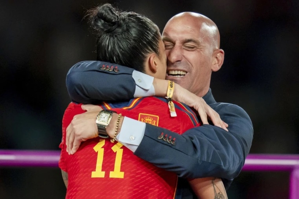 FIFA slapped ex-Spanish FA president Luis Rubiales (R) a three-year ban over kissing scandal subject to Spain Women forward Jenni Hermoso (L)-File
