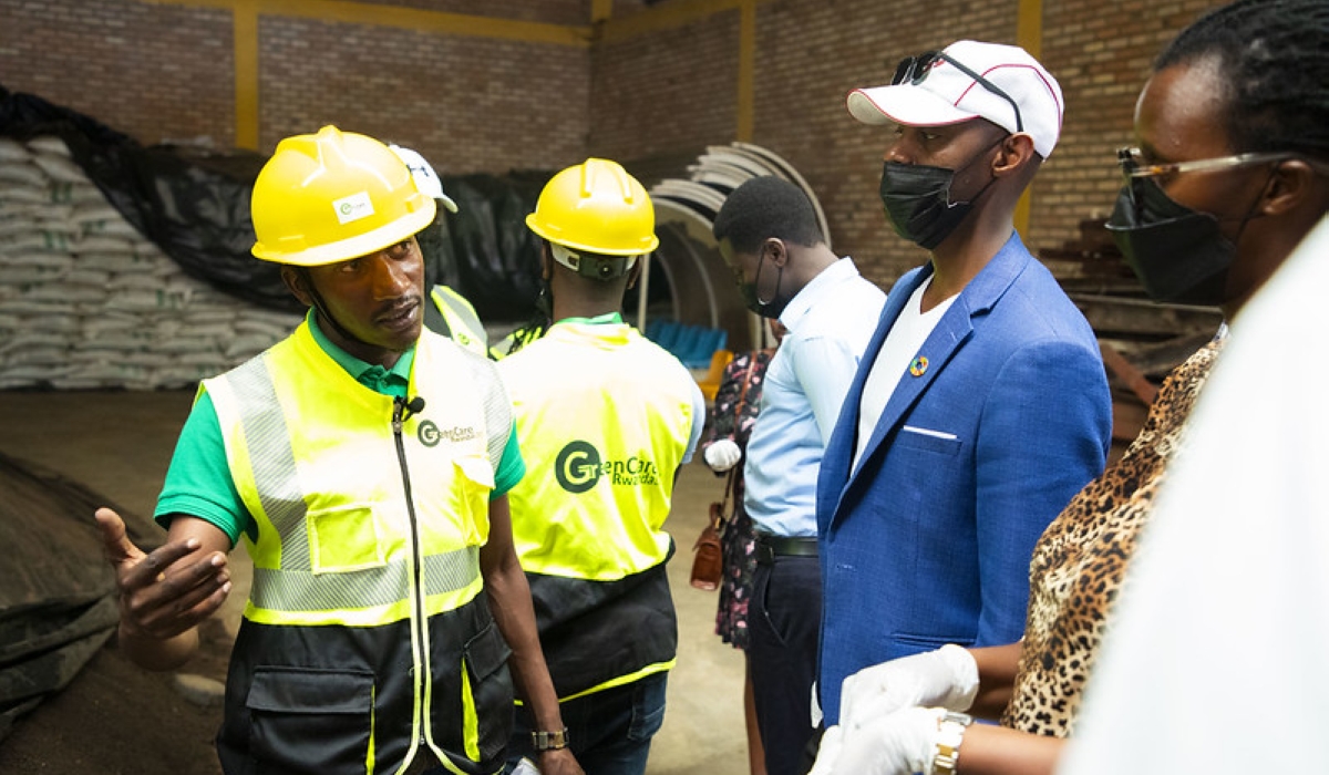 Noel Nizeyimana explains the process of how pavers are made out of plastics. Courtesy photos
