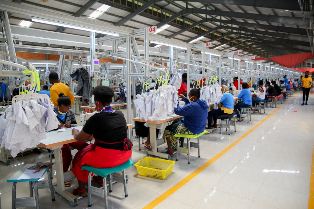 Workers at Pink Mango C&D – a Hong Kong-based textile manufacturer that acquired former C&H Garment Factory at Kigali Special Economic Zone on 26 November 2020. File