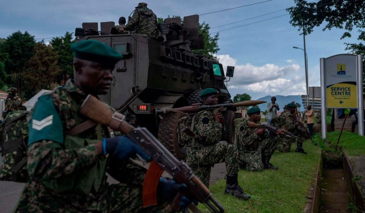 Members of Uganda Peoples&#039; Defence Forces position themselves on the Ugandan side of the border town in Bunagana, Democratic Republic of Congo on March 30, 2023. PHOTO: AFP
