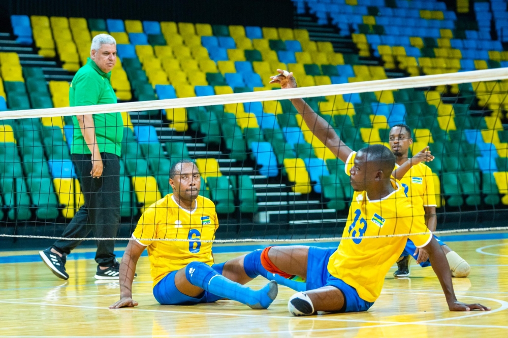 Rwanda Sitting Volleyball team head coach Mossad Rashad inspects how players perform during a training session. COURTESY