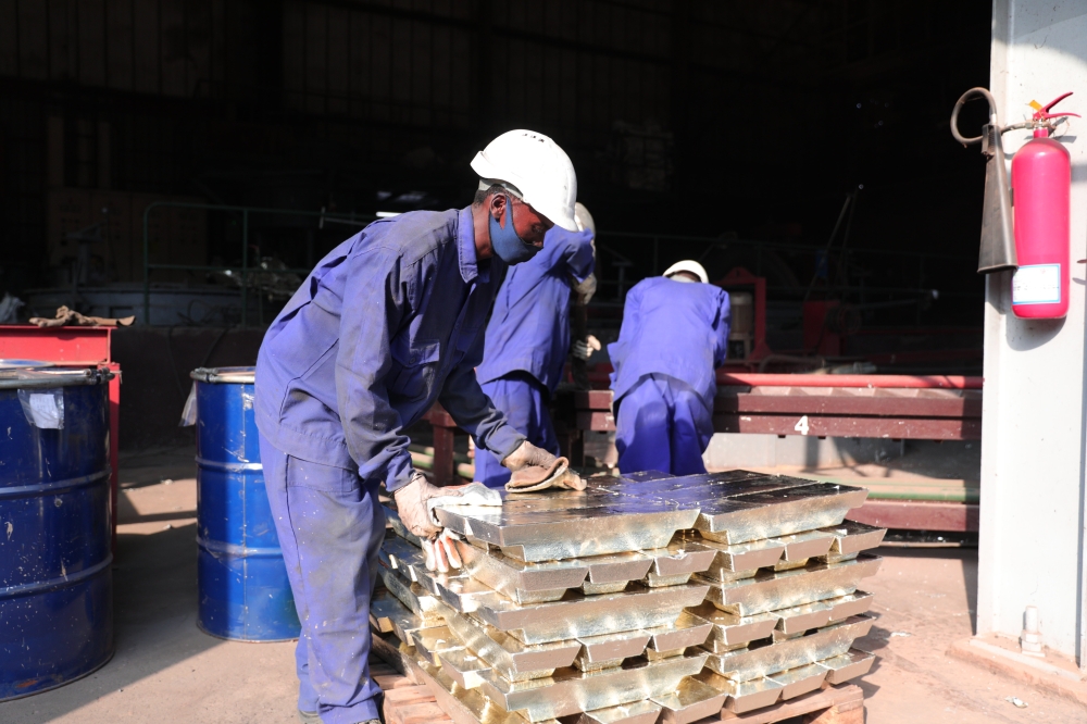Workers arrange melted tin for export at LuNa Smelter in Kigali. Rwanda’s mineral exports raked in $241,823,194 worth of revenues in the third quarter (from July to September). SAM NGENDAHIMANA