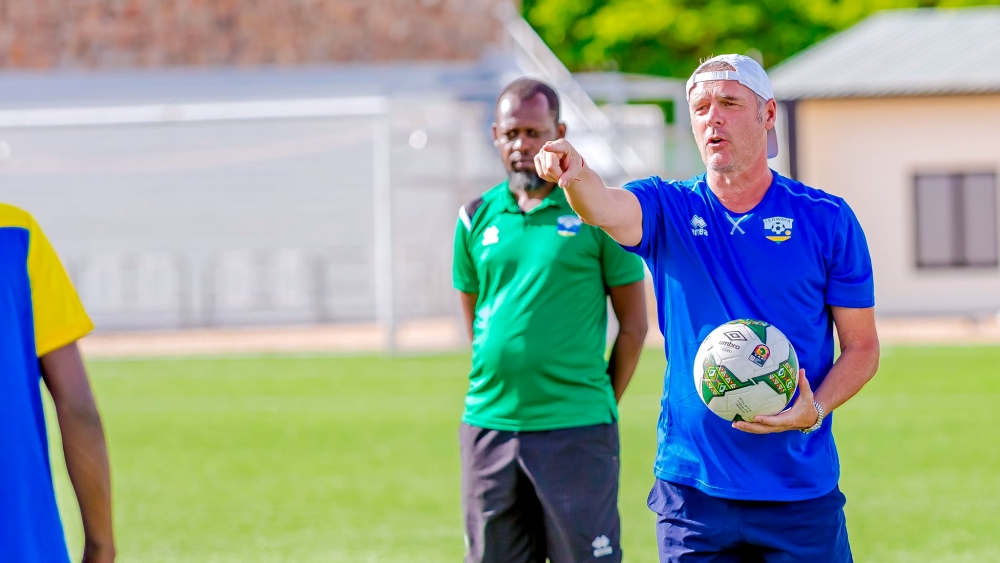 The newly appointed Amavubi head coach Torsten Frank Spittler speaks to his players during a training session at Kigali Pele Stadium. Courtesy