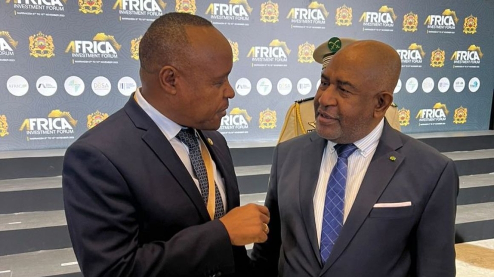 EAC Secretary-General Dr Peter Mathuki (left) converses with Comoros President Azali Assoumani, who is also the African Union Chairperson, on the sidelines of the Africa Investment Forum in Marrakech, Morocco, on November 8. PHOTO: POOL