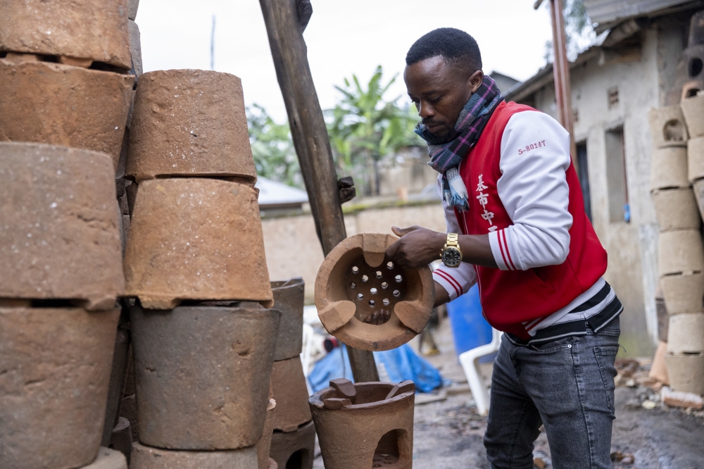 Didier Hakizimana, a 35-year-old entrepreneur arranges his stoves. He has chosen to make an impact with his innovative ‘Canarimwe stoves’. PHOTOS BY OLIVIER MUGWIZA