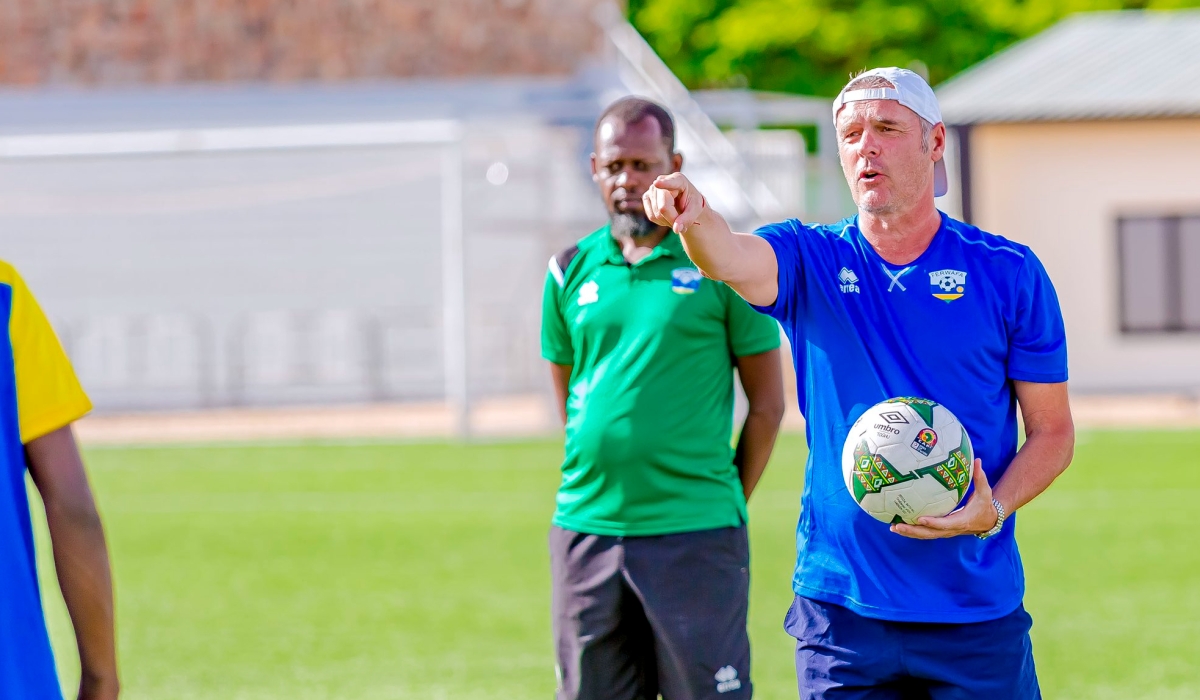 The newly appointed Amavubi head coach Torsten Frank Spittler speaks to his players during a training session at Kigali Pele Stadium. Courtesy