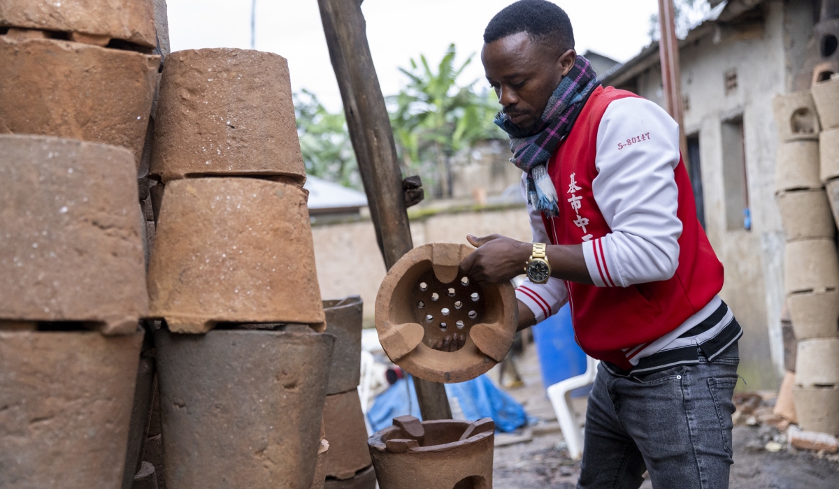 Didier Hakizimana, a 35-year-old entrepreneur arranges his stoves. He has chosen to make an impact with his innovative ‘Canarimwe stoves’. PHOTOS BY OLIVIER MUGWIZA