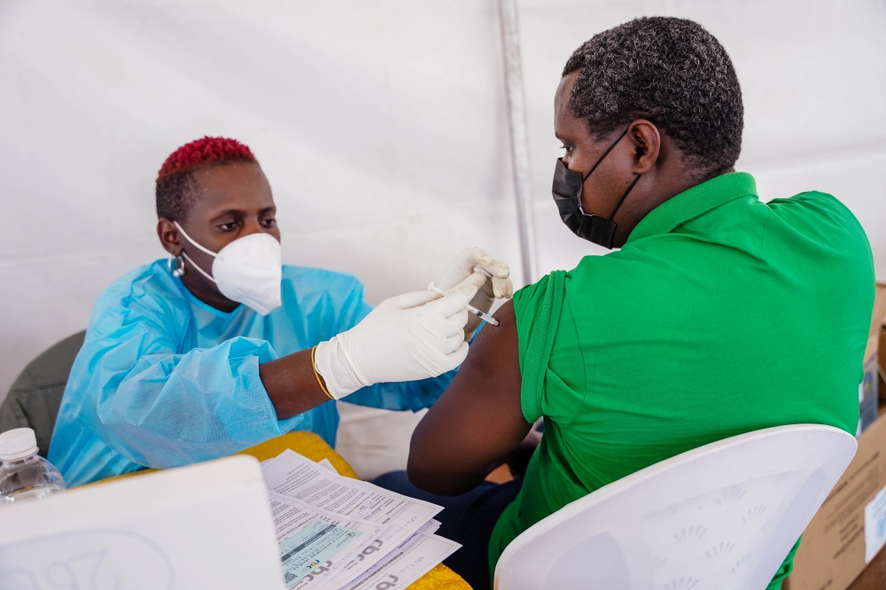 A health worker conducts a vaccination exercise at Nyabugogo Taxis Park on December 13, 2021. File