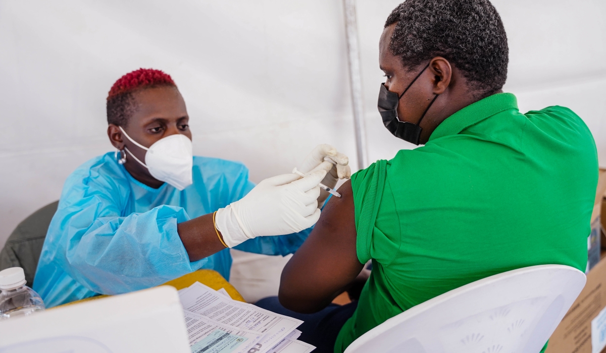 A health worker conducts a vaccination exercise at Nyabugogo Taxis Park on December 13, 2021. File