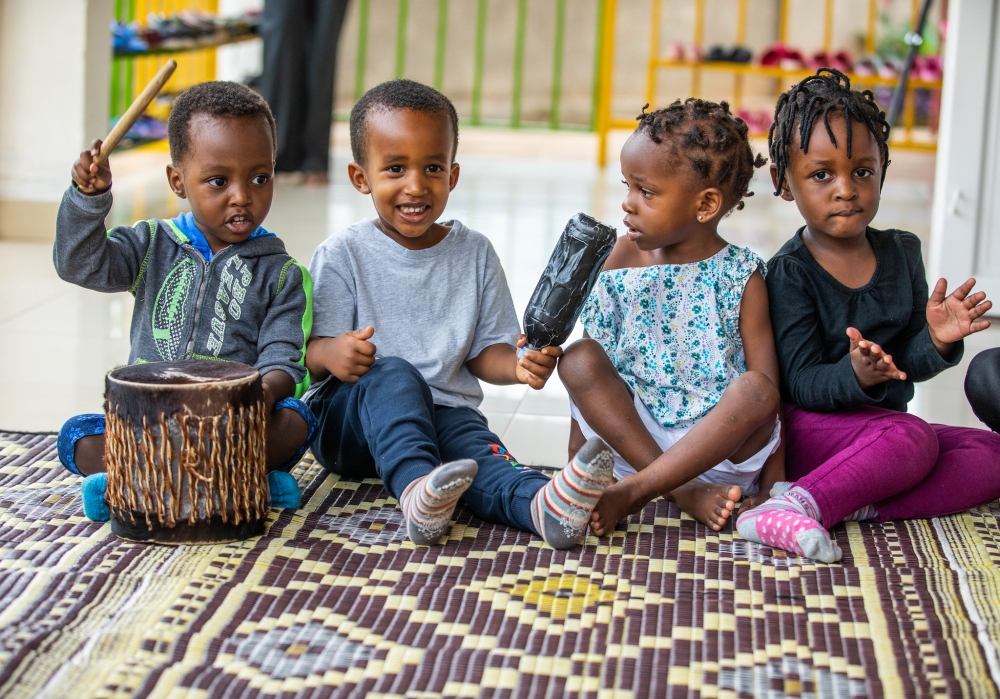 Children sing Rwandan traditional songs during a recreational break at Happy Hearts daycare. Photo by Will Mucyo