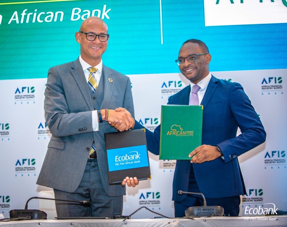 Ecobank Group CEO Mr. Jeremy Awori (left) and African Guarantee Fund Group CEO, Mr. Jules Ngankam exchange the USD200 million risk sharing agreement after it was signed in Lome, Togo