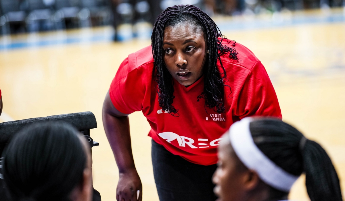 Rwanda Energy Group (REG) women basketball club coach Esperance Mukaneza gives instructions to players during a league game against APR BBC.  Photo by Dan Gatsinzi