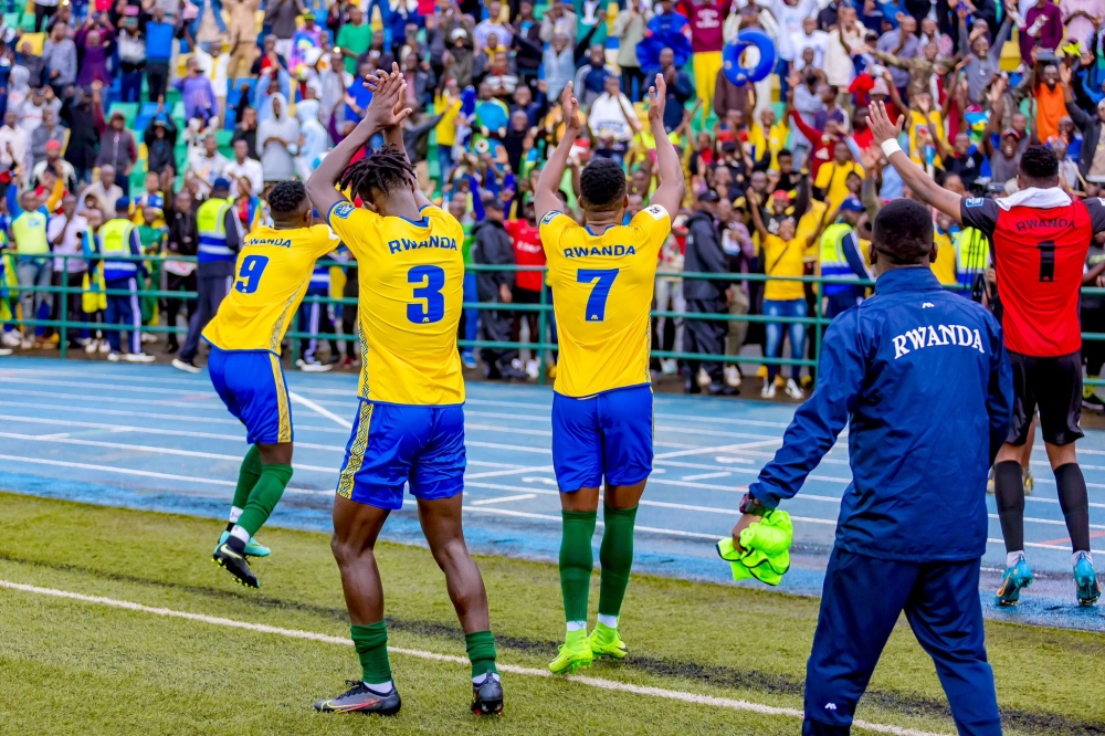 Amavubi players cheer on supporters during the celebration of the 2-0 victory as they stun Bafana Bafana at Huye Stadium on November 21.