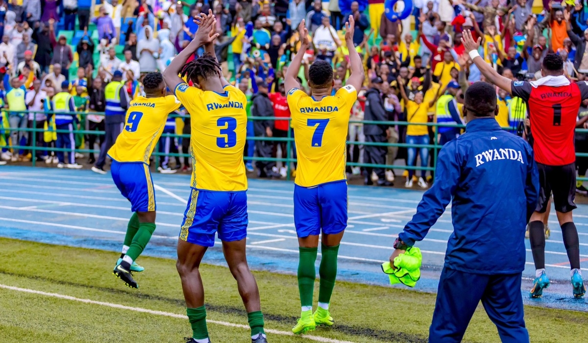 Amavubi players cheer on supporters during the celebration of the 2-0 victory as they stun Bafana Bafana at Huye Stadium on November 21.