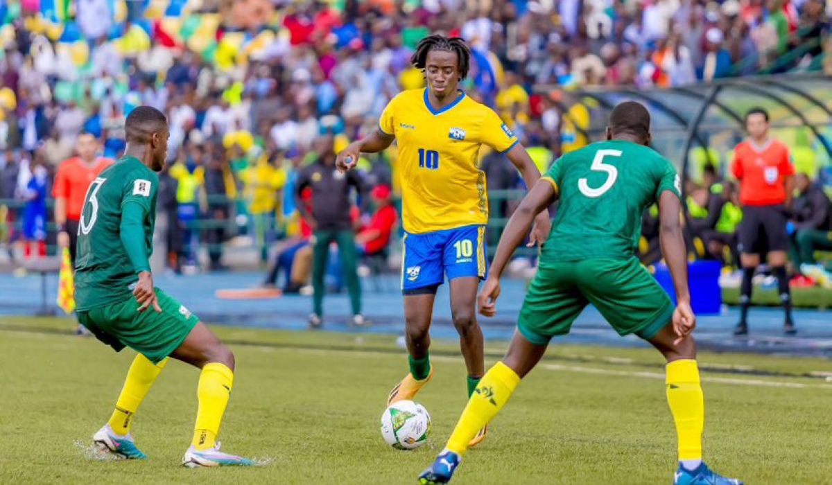 National team attacking midifilder Hakim Sahabo ties to go past Bafana Bafana defenders during a 2-0 match at Huye Stadium on Tuesday. Courtesy