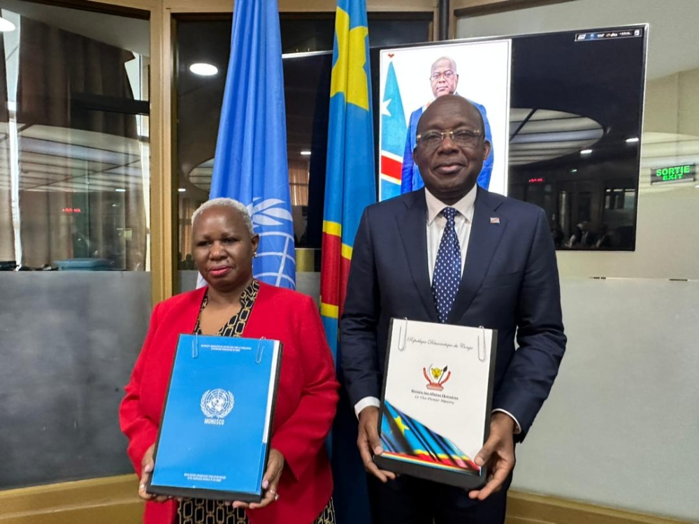 MONUSCO’s head Bintou Keita and DR Congo’s Foreign Minister Christophe Lutundula pose for a photo after signing the agreement in Kinshasa. Courtesy
