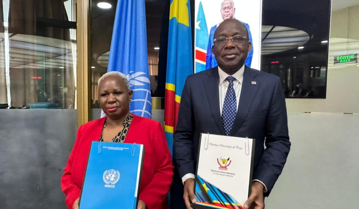 MONUSCO’s head Bintou Keita and DR Congo’s Foreign Minister Christophe Lutundula pose for a photo after signing the agreement in Kinshasa. Courtesy