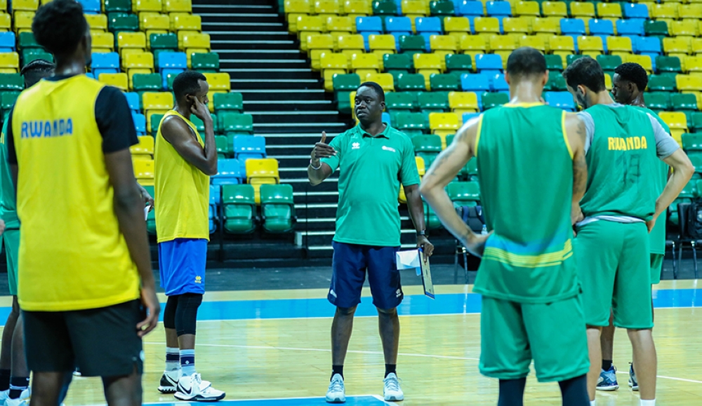Cheikh Sarr, the head coach of the national basketball team gives instructions to the players during a training session at BK Arena on June 13. 2022.
