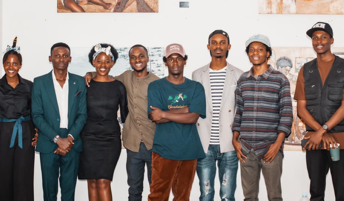 Daniel Rukundo with different people who visited his first solo exhibition, Frame of Mind.