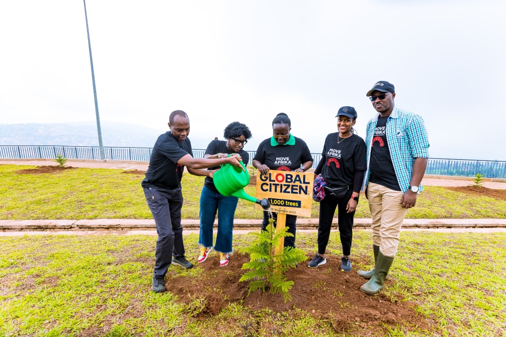 The CEO of Rwanda of Rwanda Development Board (RDB), Francis Gatare (L) with other officials during a tree planting exercise at Mount Rebero in Kigali City on Saturday, November 25.  PHOTOS BY CRAISH BAHIZI