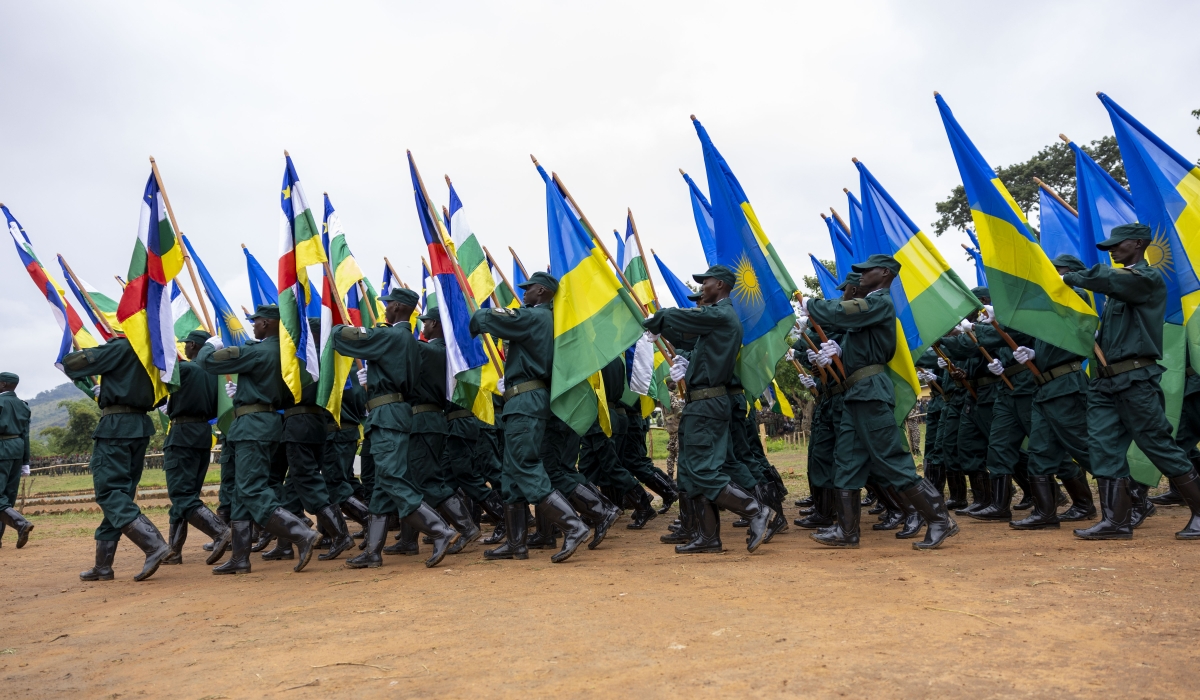 A group of Central African Republic (CAR) soldiers, who were trained by the Rwanda Defence Force (RDF) under a bilateral agreement on defence between the two countries, march with Rwandan and CAR flags at the graduation ceremony on Friday, November 24. Olivier Mugwiza /The New Times