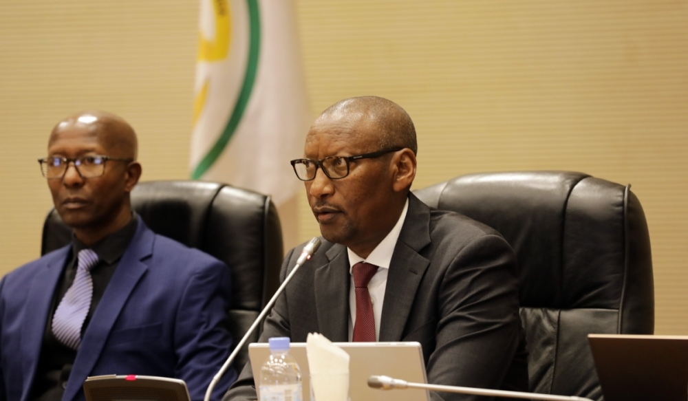 The National Bank of Rwanda Governor, John Rwangombwa (R), presents the central bank’s annual report for the financial year 2022/2023 to Parliament, as the Deputy Speaker in charge of Finance and Administration at the Lower House, Sheikh Mussa Fazil Harerimana, looks on , on November 27, 2023