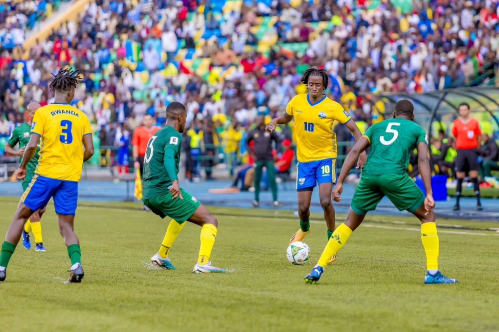 National team attacking midfielder Hakim Sahabo tries to go past Bafana Bafana players during a 2-0 game at Huye Stadium. COURTESY