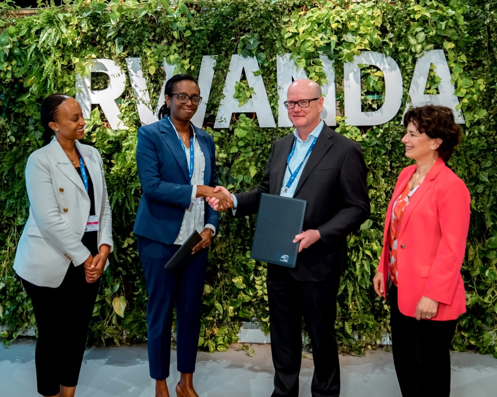 Thomas Östros, the Vice President of the European Investment Bank and Diane Karusisi, the CEO of Bank of Kigali after  signing the agreement at COP28 in Dubai, on December 2. Courtesy