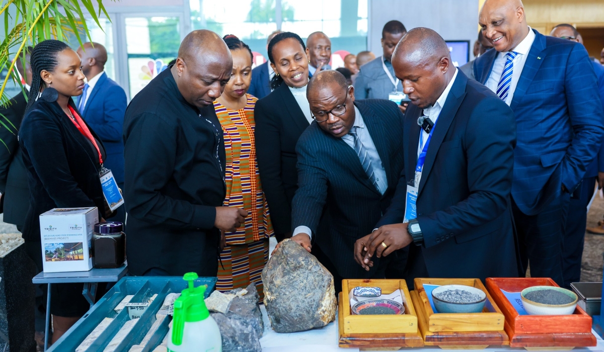 Prime Minister Edouard Ngirente with officials during a tour of an exhibition during the opening of the mining week on Monday, December 4. Courtesy 