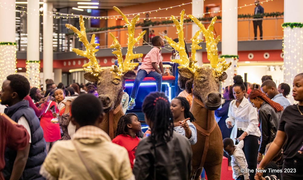Children and their parents during a delightful sign of holiday spirit, when the five-star hotel ushered in the festive season with a tree lighting ceremony. Photos by Dan Gatsinzi
