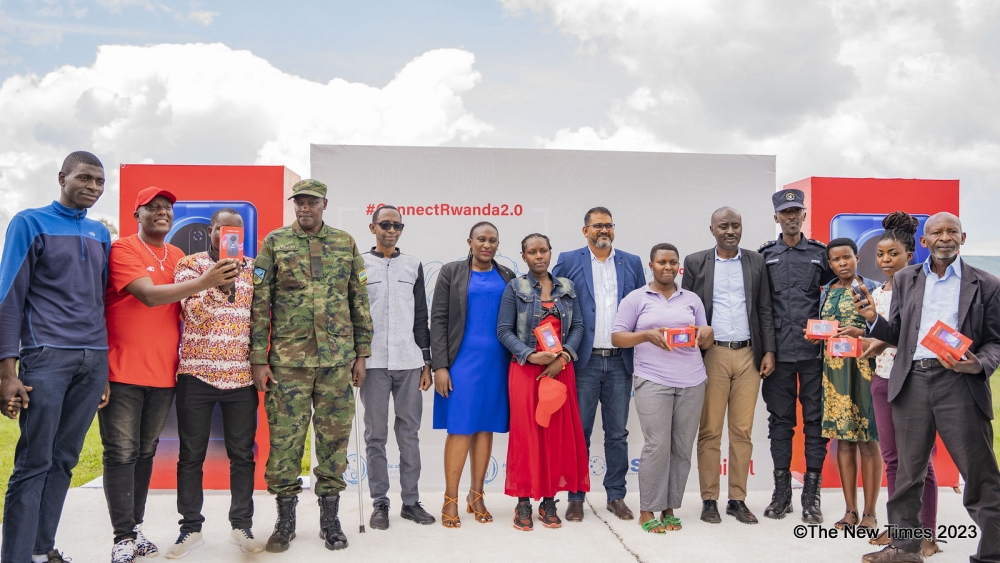 Officials and some residents pose for a photo as Airtel Rwanda took the second phase of the Connect Rwanda campaign, known as ConnectRwanda 2.0, to Nyanza District , on December 4. Emmanuel Dushimimana
