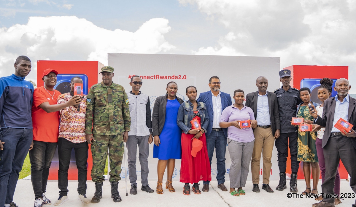 Officials and some residents pose for a photo as Airtel Rwanda took the second phase of the Connect Rwanda campaign, known as ConnectRwanda 2.0, to Nyanza District , on December 4. Emmanuel Dushimimana