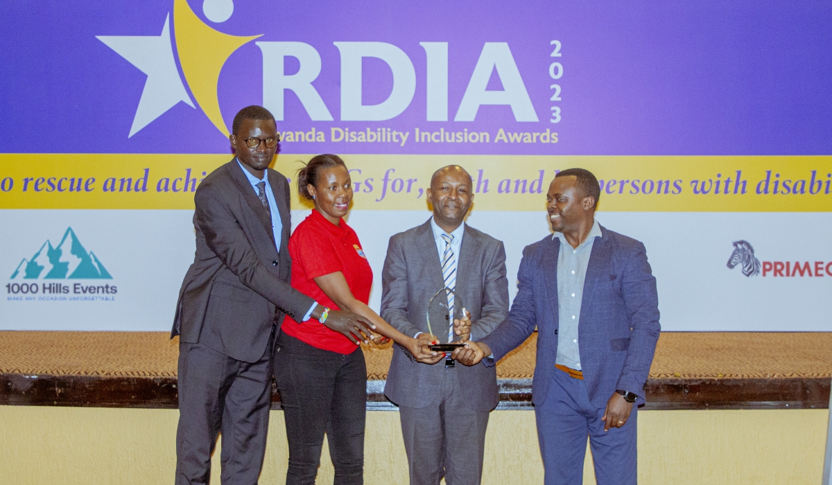 Dr. Kimemia Martin receiving the award during the function