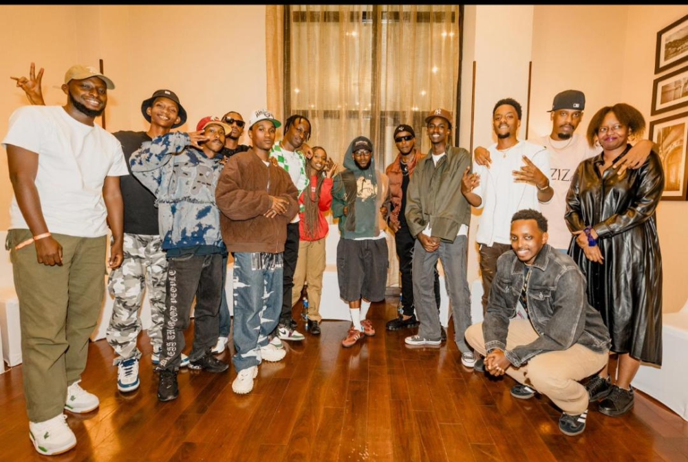Celebrated American Hip-Hop star Kendrick Lamar poses for a group photo with the Rwandan rappers ahead of his highly anticipated performance at BK Arena in Kigali on December 6. Courtesy.