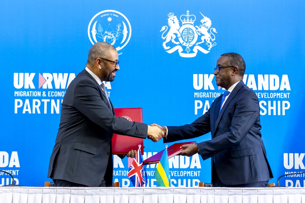 The Minister of Foreign Affairs and International Cooperation, Dr Vincent Biruta, and UK Home Secretary James Cleverly during the signing of a new migration treaty between the two countries in Kigali, December 5. Olivier Mugwiza