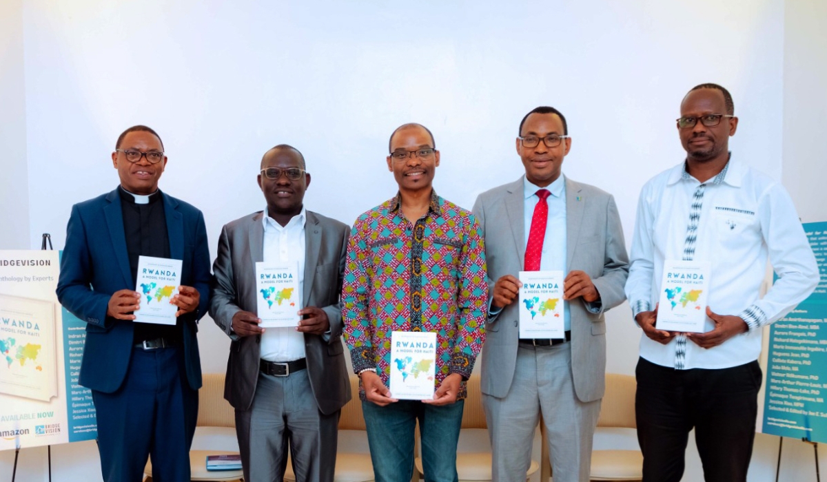 Some of the contributing authors hold some copies of the book during a pre- launch private event on December 3. . Photo: Courtesy